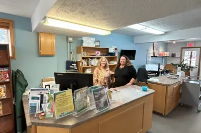 Checkout desk and library staff in Mildmay